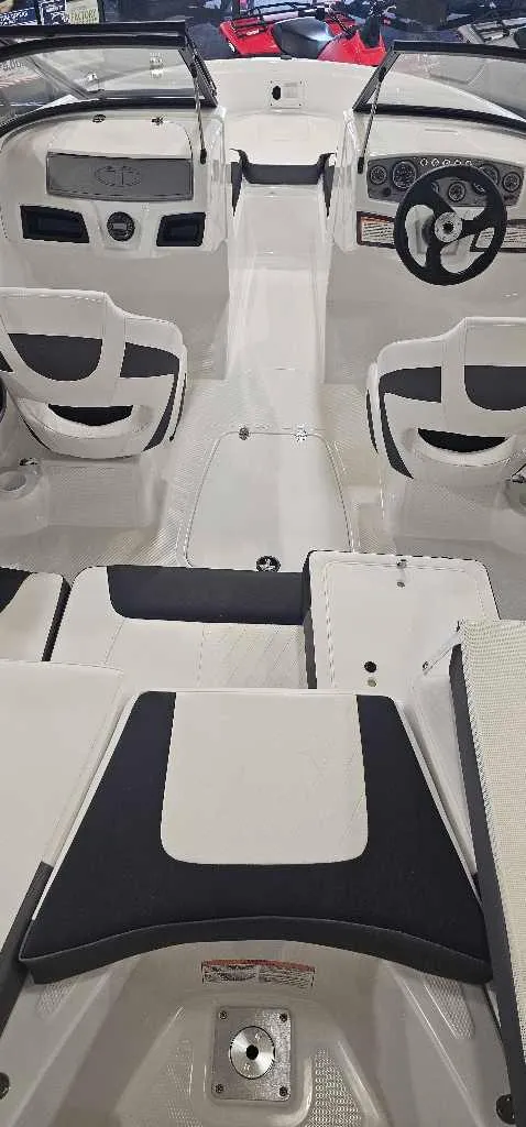 Slide: The Image of 2024 Tahoe 185 S boat interior with dual consoles and seating. - 3