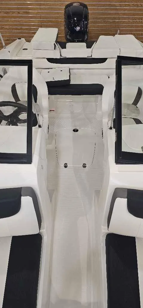 Slide: The Image of 2024 Tahoe 185 S boat interior with dual consoles and outboard motor. - 4