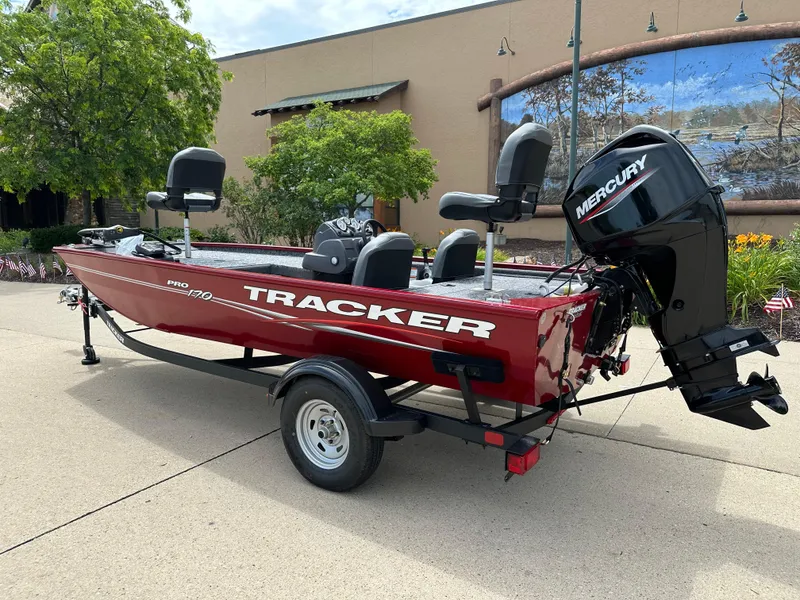 Slide: The Image of 2024 Tracker Pro 170 fishing boat with Mercury outboard motor on a trailer. - 2