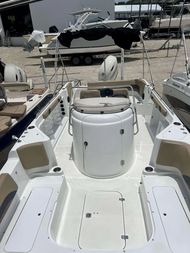 Slide: The Image of 2020 Hurricane 231 SS boat interior with seating and storage compartments. - 10