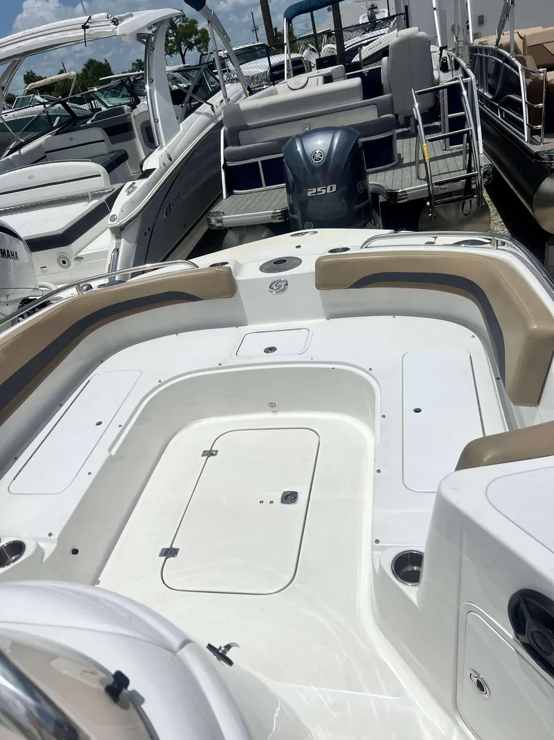 Slide: The Image of 2020 Hurricane 231 SS boat interior with seating and storage compartments. - 5