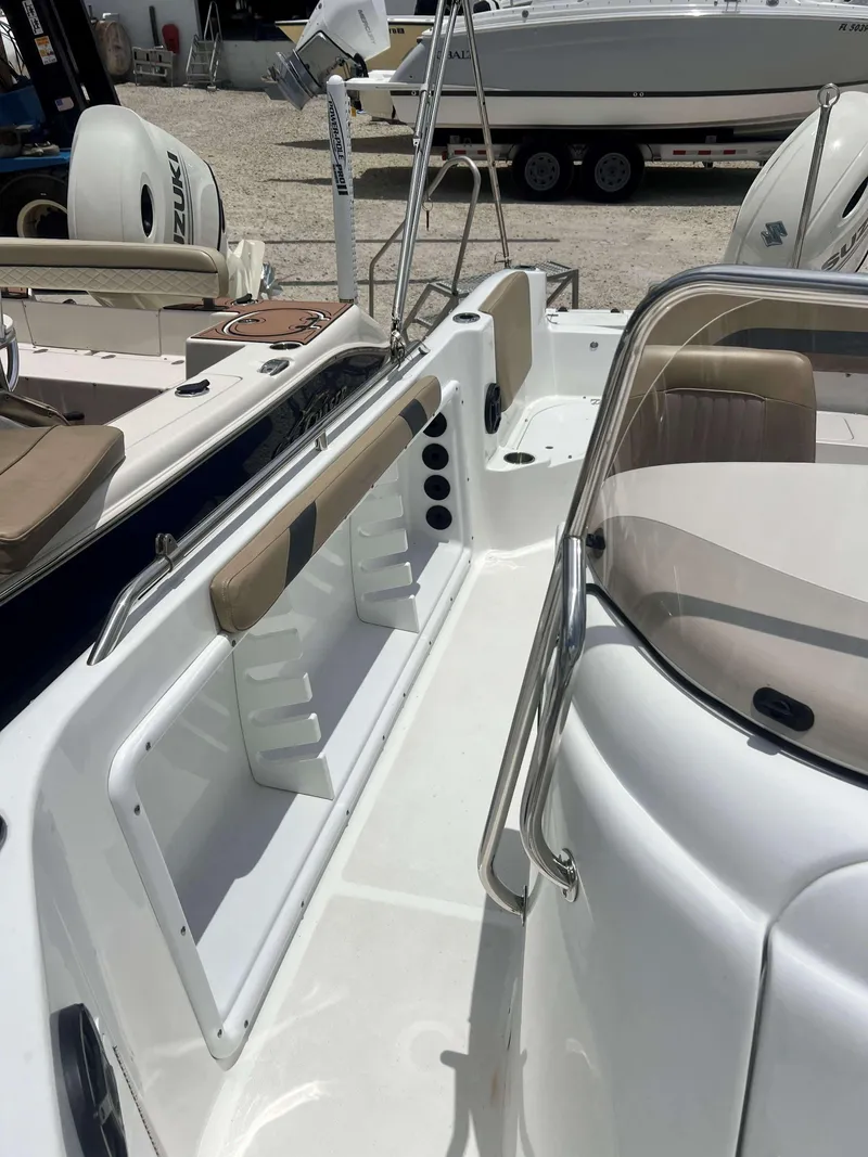 Slide: The Image of 2020 Hurricane 231 SS boat interior with Suzuki outboard motor and seating area. - 7