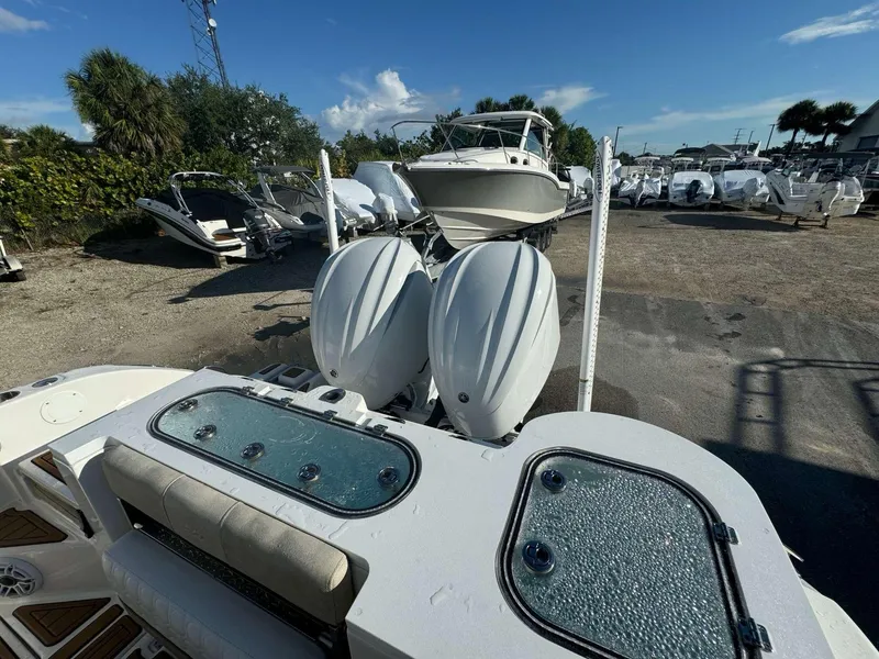 Slide: The Image of 2022 Sea Fox 288 Commander with dual outboard engines in a boatyard. - 5