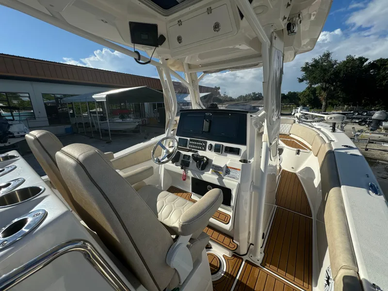 Slide: The Image of 2022 Sea Fox 288 Commander boat interior with helm station and seating. - 6