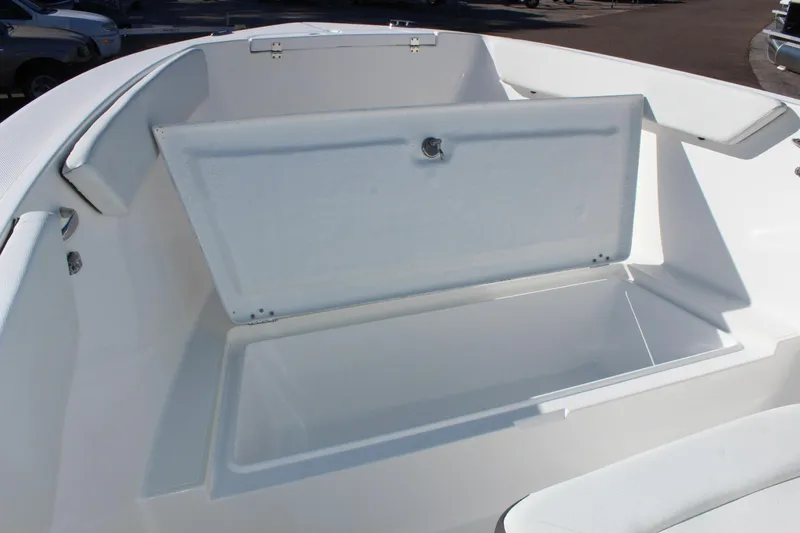 Slide: The Image of 2024 Clearwater 2300 WI boat with open storage compartment. - 12