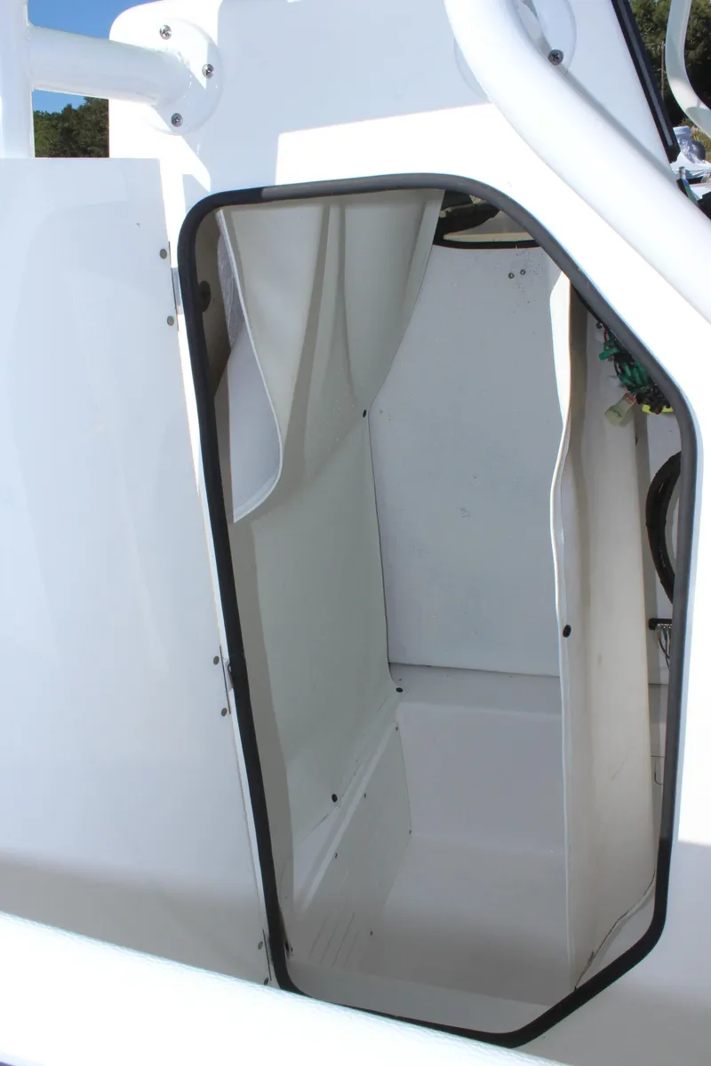 Slide: The Image of 2024 Clearwater 2300 WI boat storage compartment. - 16