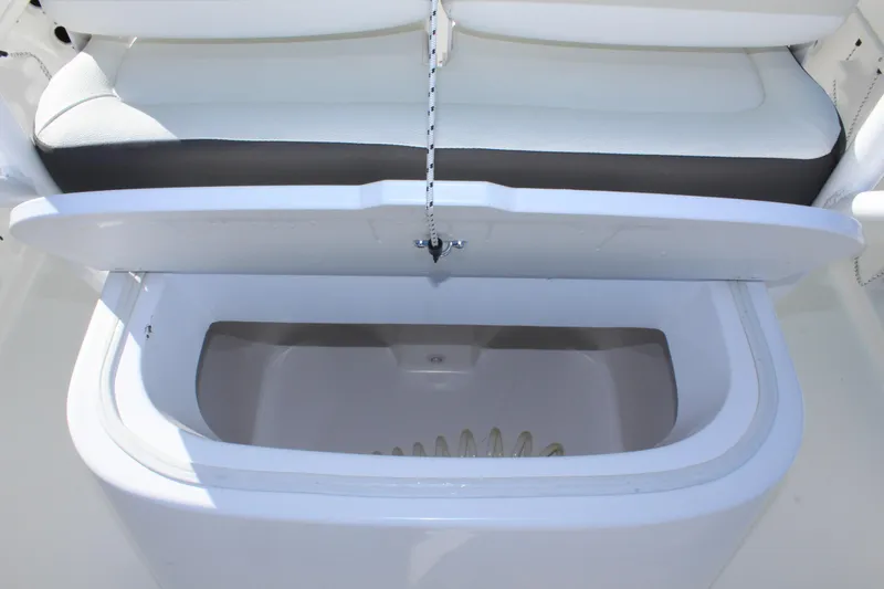 Slide: The Image of Open storage compartment on a 2024 Clearwater 2300 WI boat. - 27
