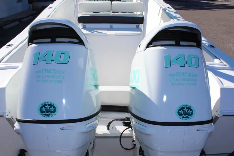 Slide: The Image of 2024 Clearwater 2300 WI boat with twin Suzuki 140 outboard motors. - 31