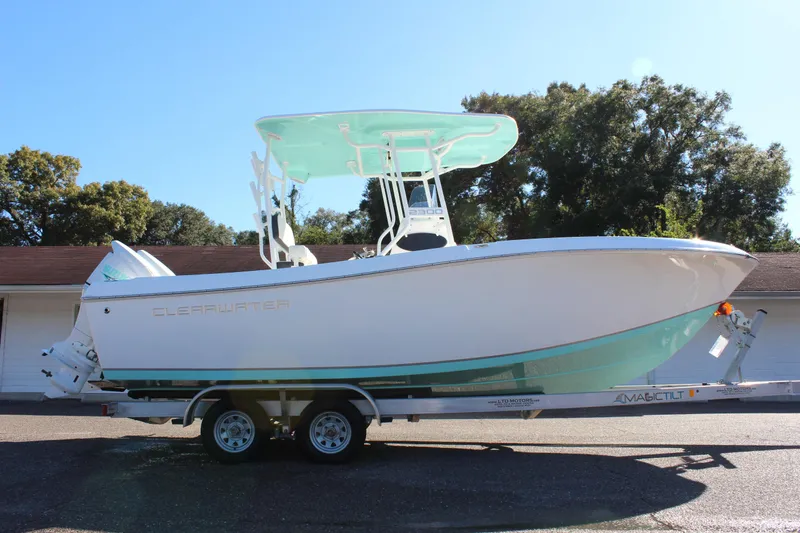 Slide: The Image of 2024 Clearwater 2300 WI boat on a trailer, side view. - 4