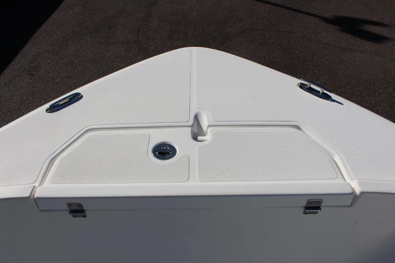 Slide: The Image of 2024 Clearwater 2300 WI boat bow with storage compartment. - 7