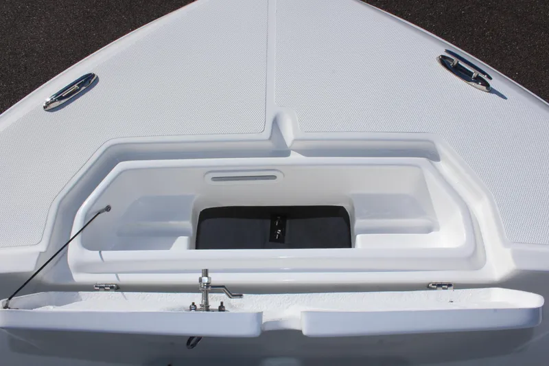 Slide: The Image of 2024 Clearwater 2300 WI boat bow storage compartment with open hatch. - 8