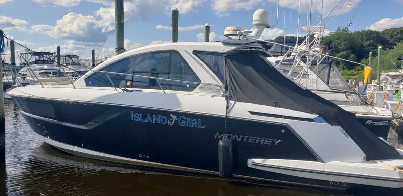 The Image of 2016 Monterey 360 Sport Coupe docked at marina under blue sky. - 0