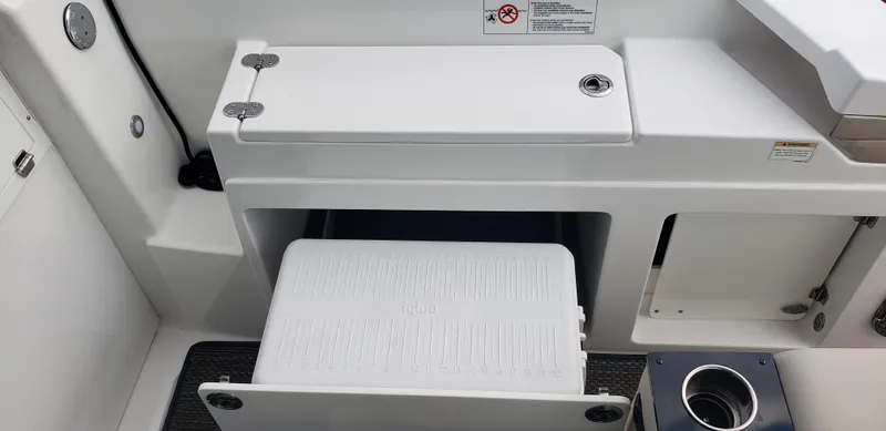 Slide: The Image of 2016 Monterey 360 Sport Coupe interior seating and storage area. - 19