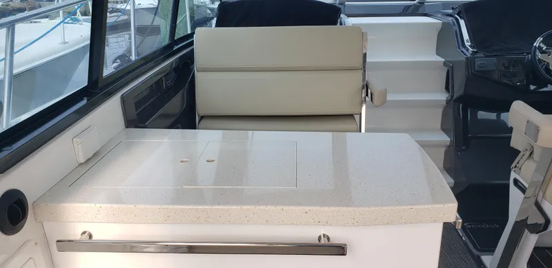 Slide: The Image of Interior of 2016 Monterey 360 Sport Coupe with seating and countertop. - 22