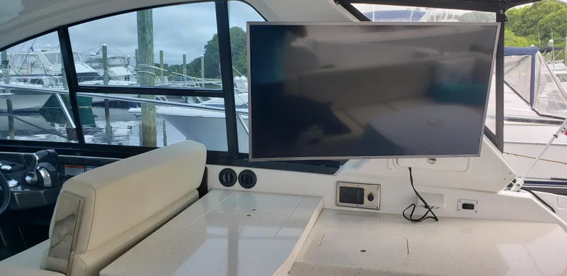 Slide: The Image of Interior of 2016 Monterey 360 Sport Coupe with TV and seating area. - 23