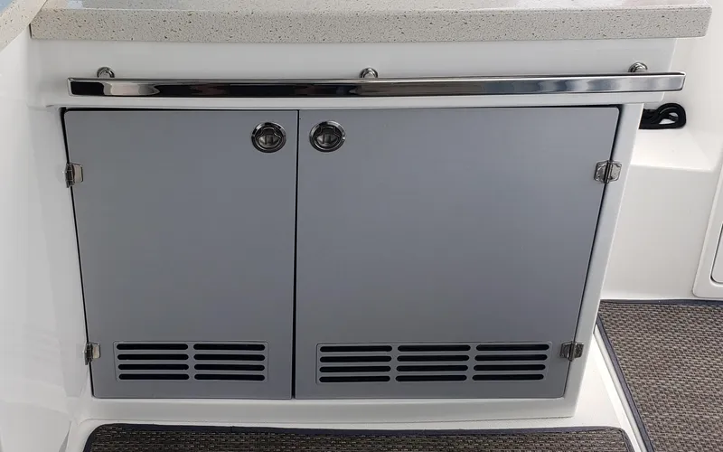 Slide: The Image of 2016 Monterey 360 Sport Coupe interior cabinet with sleek gray doors and chrome accents. - 24