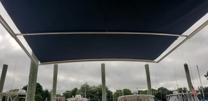 Slide: The Image of View from a 2016 Monterey 360 Sport Coupe under a canopy at a marina. - 26