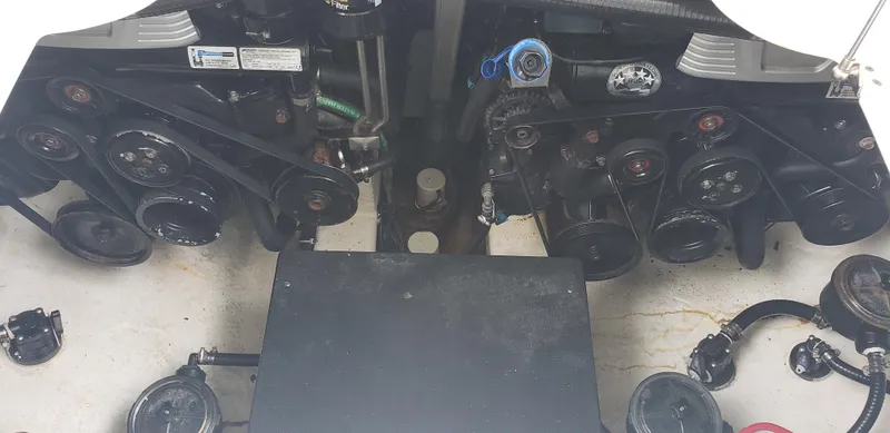 Slide: The Image of Engine compartment of a 2016 Monterey 360 Sport Coupe with visible components and belts. - 39