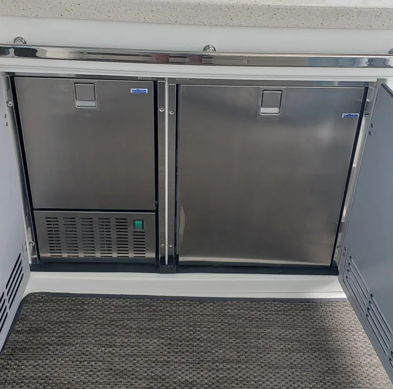 Slide: The Image of Stainless steel refrigerator and freezer on a 2016 Monterey 360 Sport Coupe boat. - 8