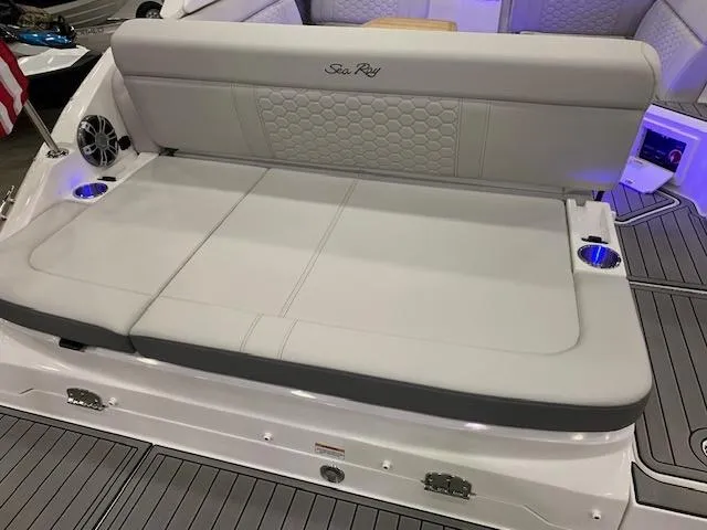 Slide: The Image of 2024 Sea Ray SDX 250 boat with spacious rear seating and cup holders. - 8