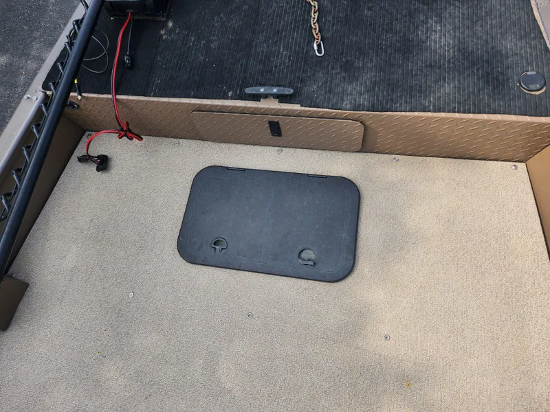 Slide: The Image of 2015 Smoker Craft Sportsman Pro 1866 boat interior with storage compartment. - 13