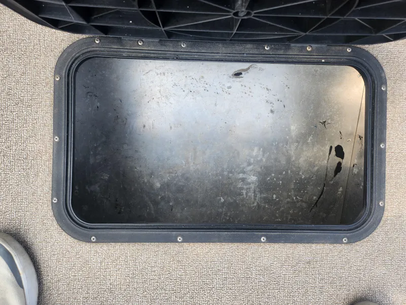 Slide: The Image of Open storage compartment of 2015 Smoker Craft Sportsman Pro 1866 boat. - 14