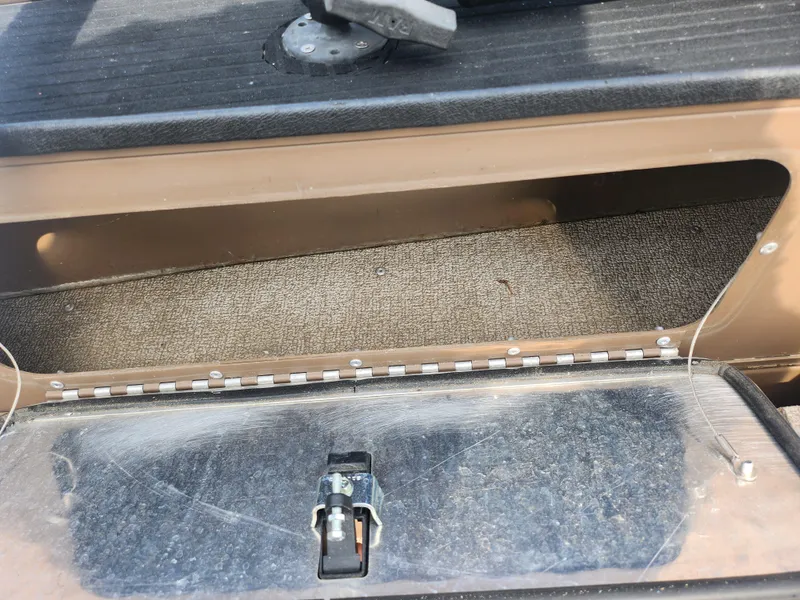 Slide: The Image of 2015 Smoker Craft Sportsman Pro 1866 storage compartment with latch. - 18