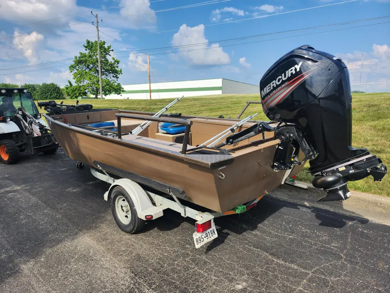 Slide: The Image of 2015 Smoker Craft Sportsman Pro 1866 boat with Mercury outboard motor on trailer. - 3