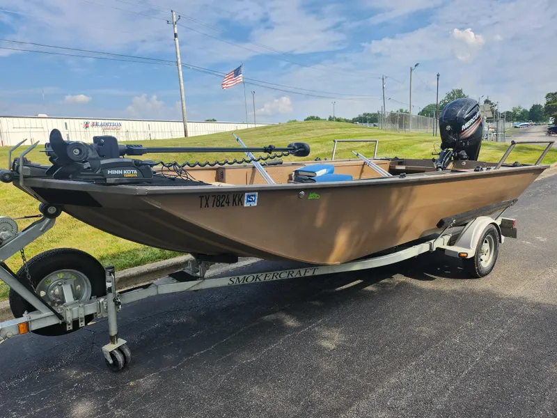 Slide: The Image of 2015 Smoker Craft Sportsman Pro 1866 boat on trailer with motor. - 6