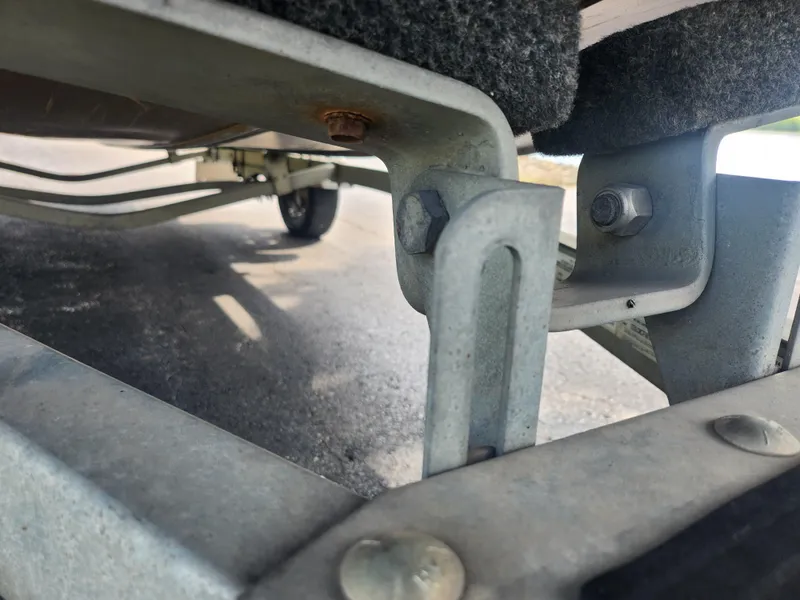 Slide: The Image of Close-up of 2015 Smoker Craft Sportsman Pro 1866 boat trailer components. - 8