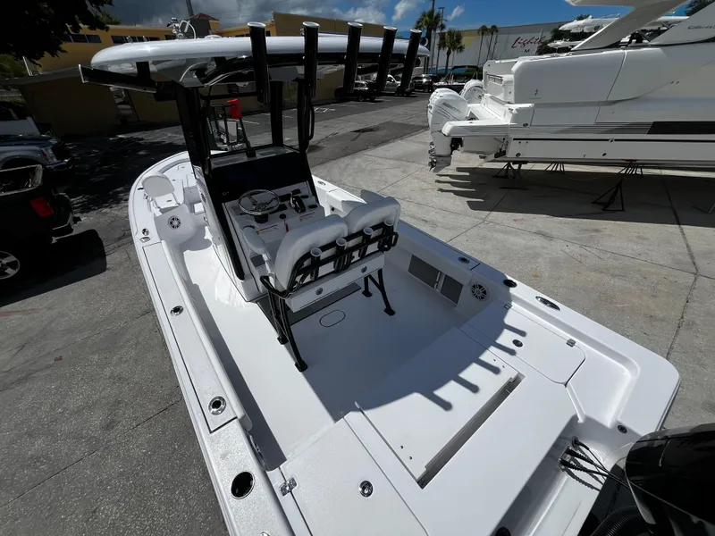 Slide: The Image of 2024 Sportsman Masters 247 Bay Boat, sleek white design, spacious deck, and modern features. - 10