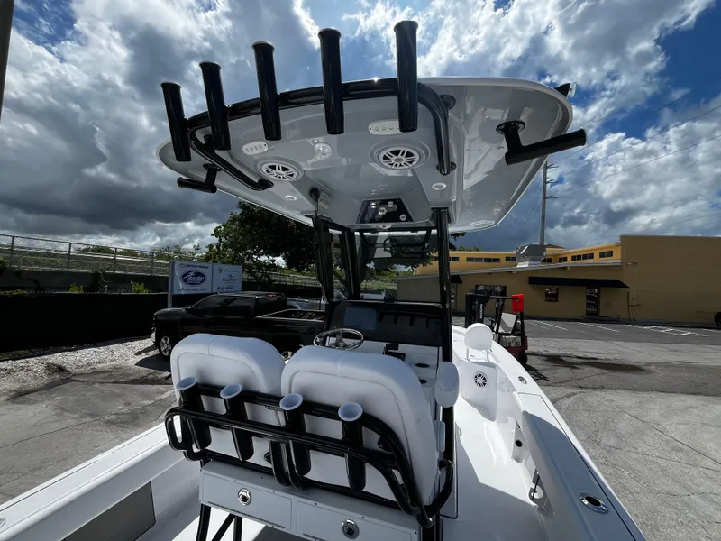 Slide: The Image of 2024 Sportsman Masters 247 Bay Boat with T-top and seating. - 11