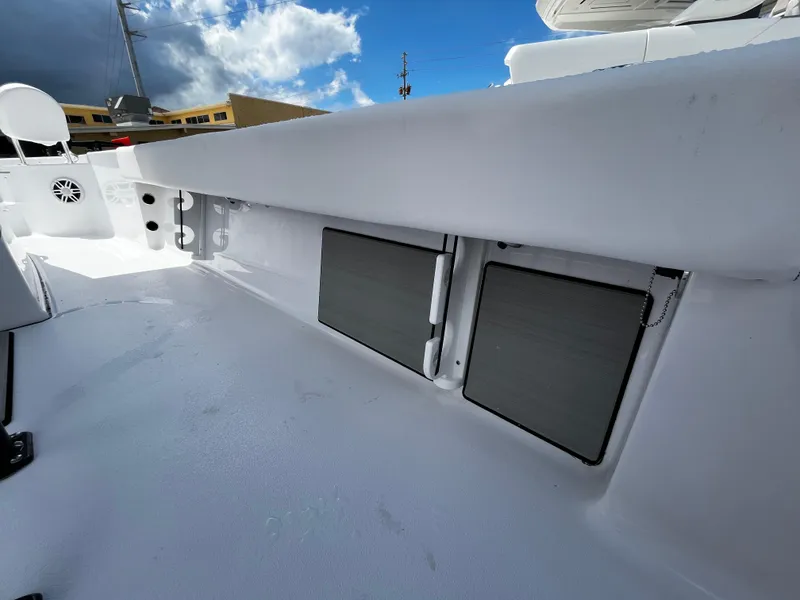 Slide: The Image of 2024 Sportsman Masters 247 Bay Boat deck with storage compartments. - 18