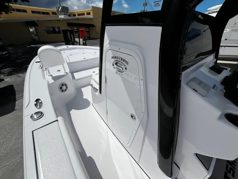 Slide: The Image of 2024 Sportsman Masters 247 Bay Boat, white interior, console view. - 20