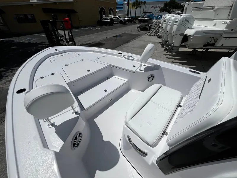 Slide: The Image of 2024 Sportsman Masters 247 Bay Boat interior with seating and storage compartments. - 21