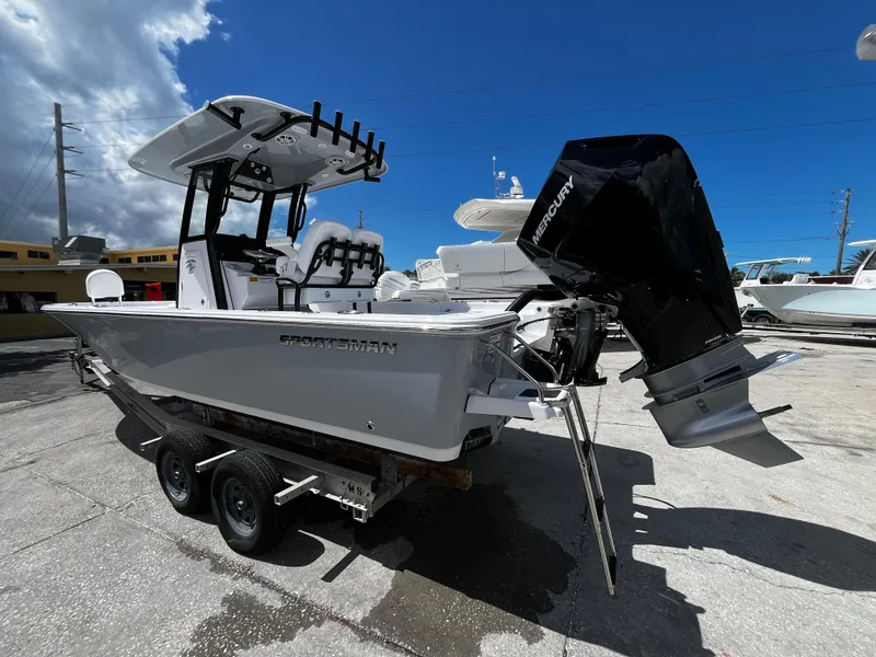 Slide: The Image of 2024 Sportsman Masters 247 Bay Boat on trailer with Mercury outboard motor. - 4