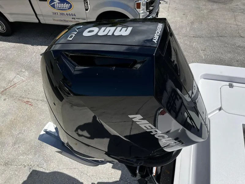 Slide: The Image of 2024 Sportsman Masters 247 Bay Boat with Mercury outboard motor. - 7