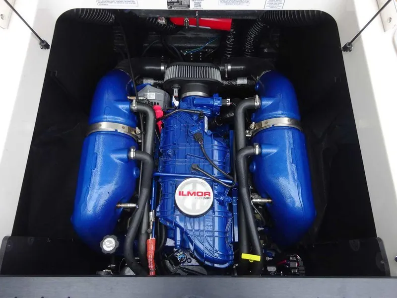 Slide: The Image of 2022 MasterCraft XT23 Ilmor engine in boat compartment. - 16