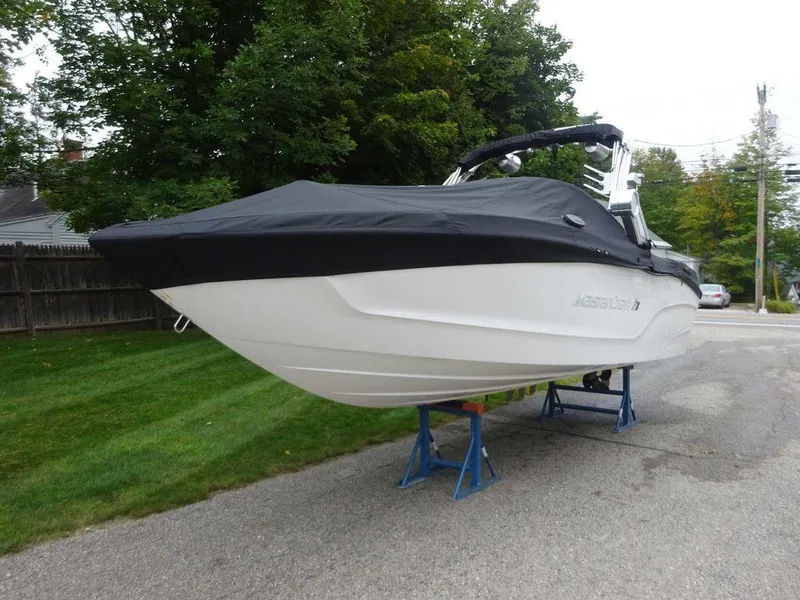 Slide: The Image of 2022 MasterCraft XT23 boat with black cover on stands. - 3