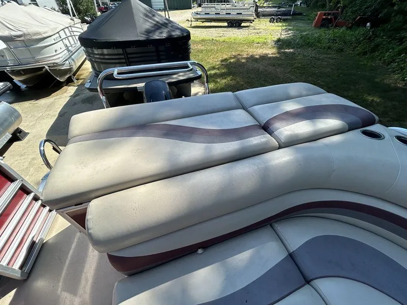 Slide: The Image of 2012 South Bay 518 CR boat with cushioned seating and cup holders. - 10