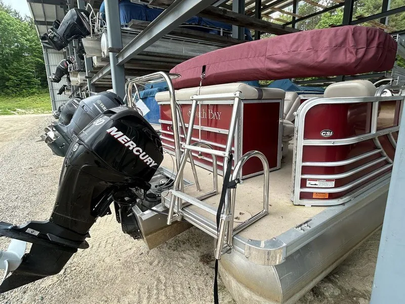 Slide: The Image of 2012 South Bay 518 CR pontoon boat with Mercury outboard motor. - 11