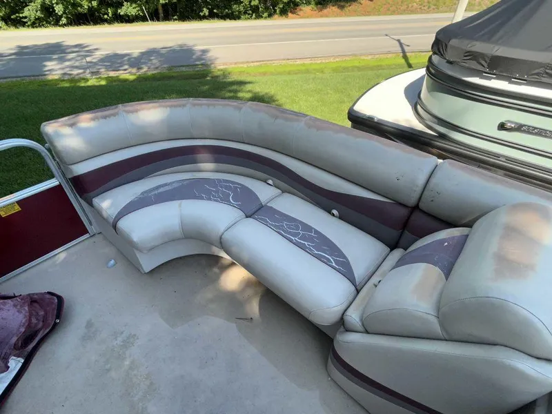 Slide: The Image of 2012 South Bay 518 CR pontoon boat seating area with curved, cushioned seats. - 12