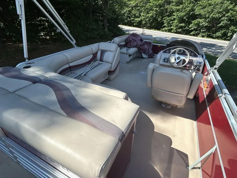 Slide: The Image of 2012 South Bay 518 CR pontoon boat with spacious seating and steering console. - 2