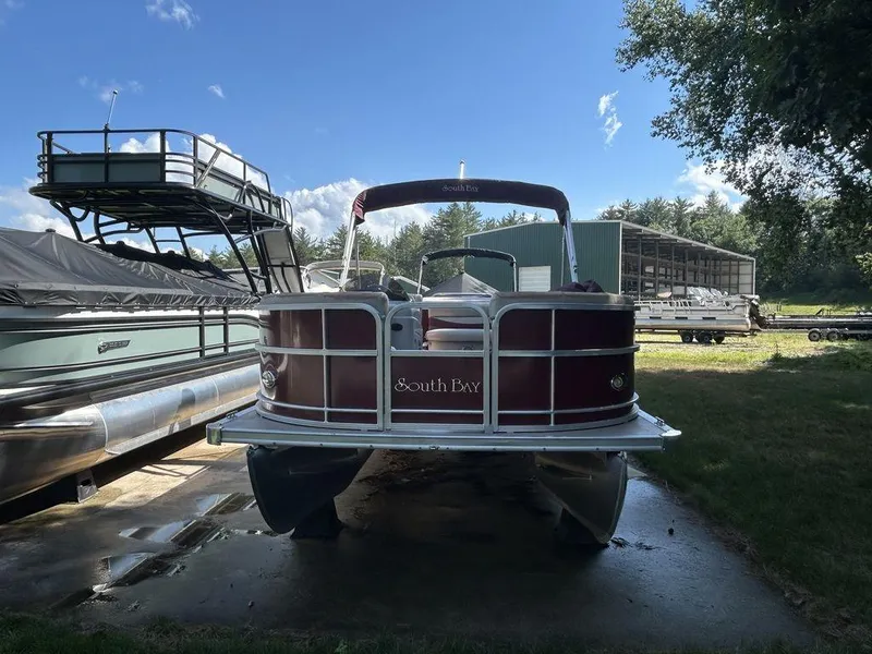 Slide: The Image of 2012 South Bay 518 CR pontoon boat docked on a sunny day. - 4