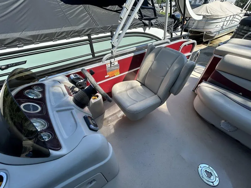 Slide: The Image of 2012 South Bay 518 CR boat interior with captain's chair and control panel. - 8