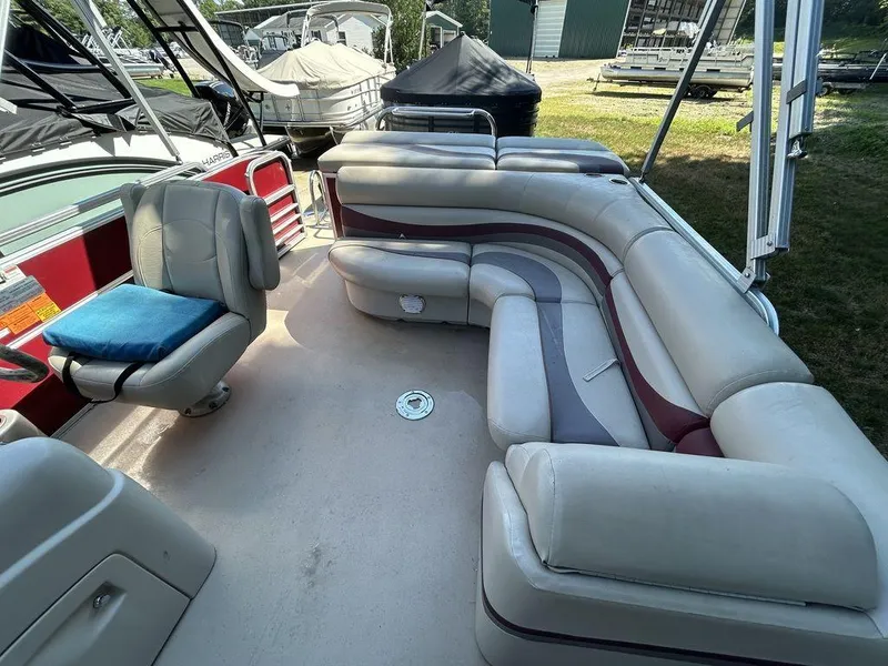 Slide: The Image of 2012 South Bay 518 CR pontoon boat interior with spacious seating and helm chair. - 9