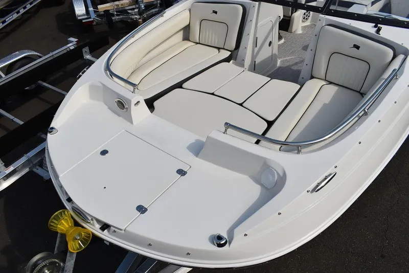 Slide: The Image of 2024 Stingray 201DC boat with spacious seating and storage compartments. - 16
