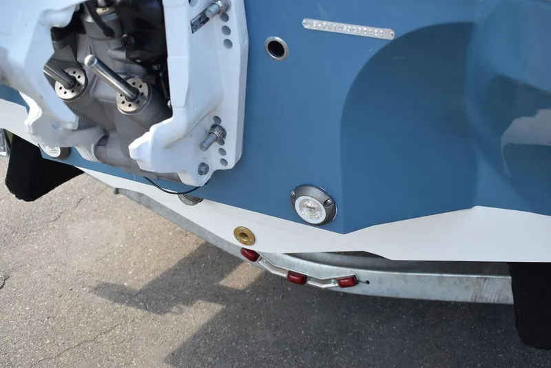 Slide: The Image of Close-up of 2024 Stingray 201DC boat engine and trailer. - 18