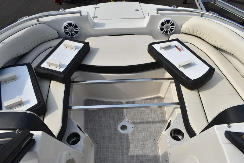Slide: The Image of 2024 Stingray 201DC boat interior with cushioned seating and storage compartments. - 40