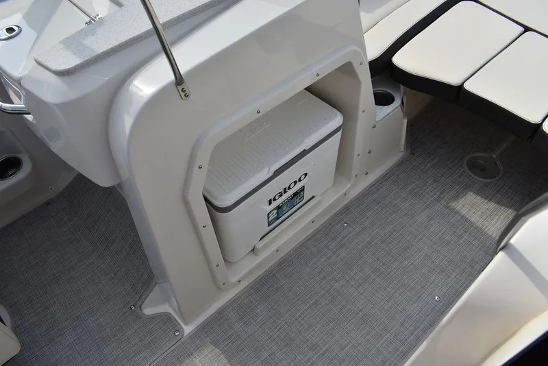 Slide: The Image of 2024 Stingray 201DC boat interior with built-in Igloo cooler. - 48